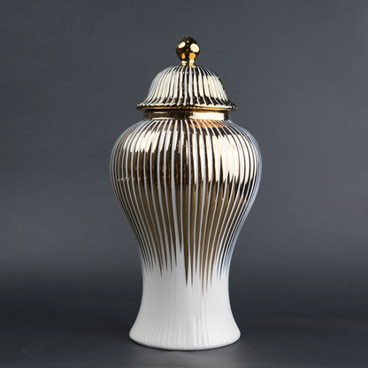 White ceramic jar with gold vertical stripes and lid for luxury home decor styling