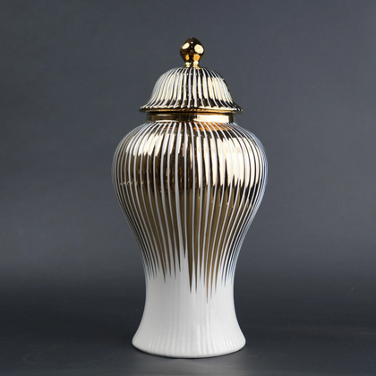 White ceramic jar with gold vertical stripes and lid for luxury home decor styling