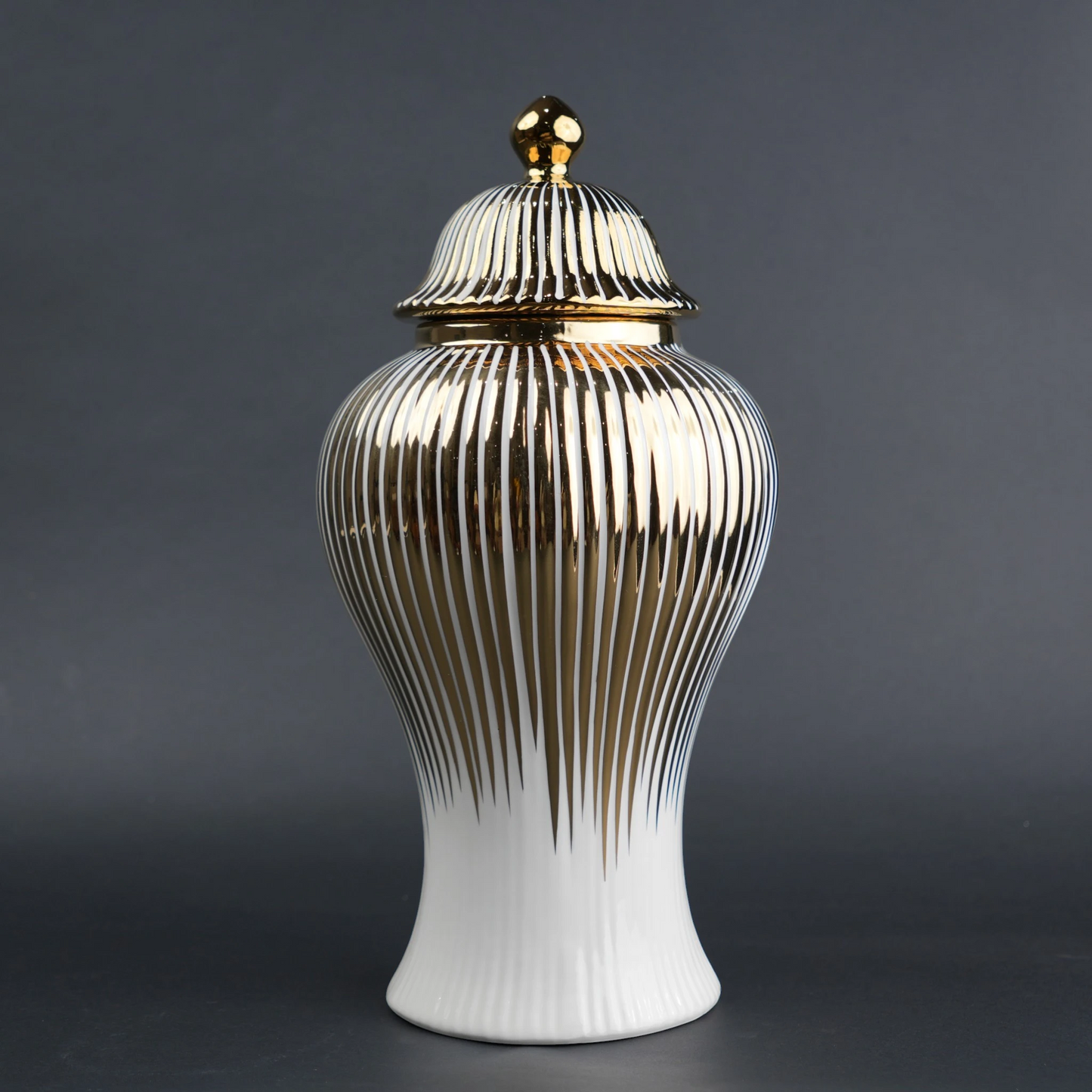 White ceramic jar with gold vertical stripes and lid for luxury home decor styling