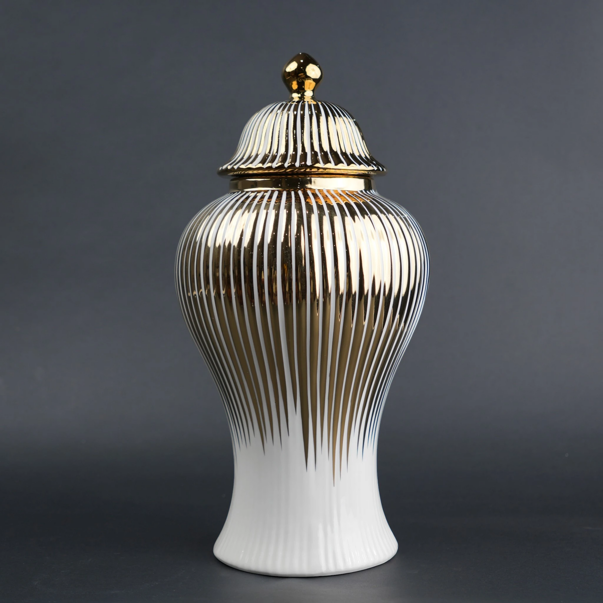 White ceramic jar with gold vertical stripes and lid for luxury home decor styling