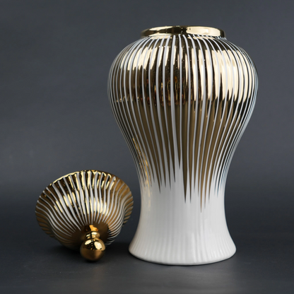 White ceramic jar with gold vertical stripes and lid for luxury home decor styling