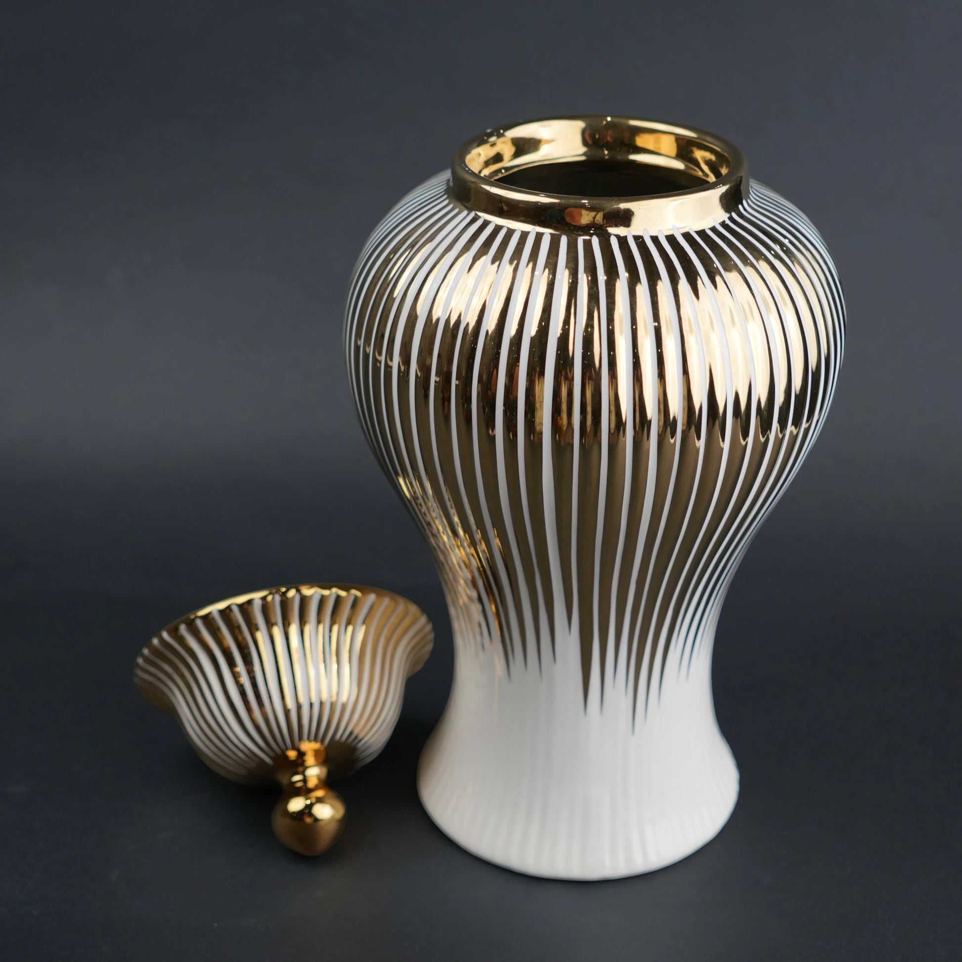 White ceramic jar with gold vertical stripes and lid for luxury home decor styling