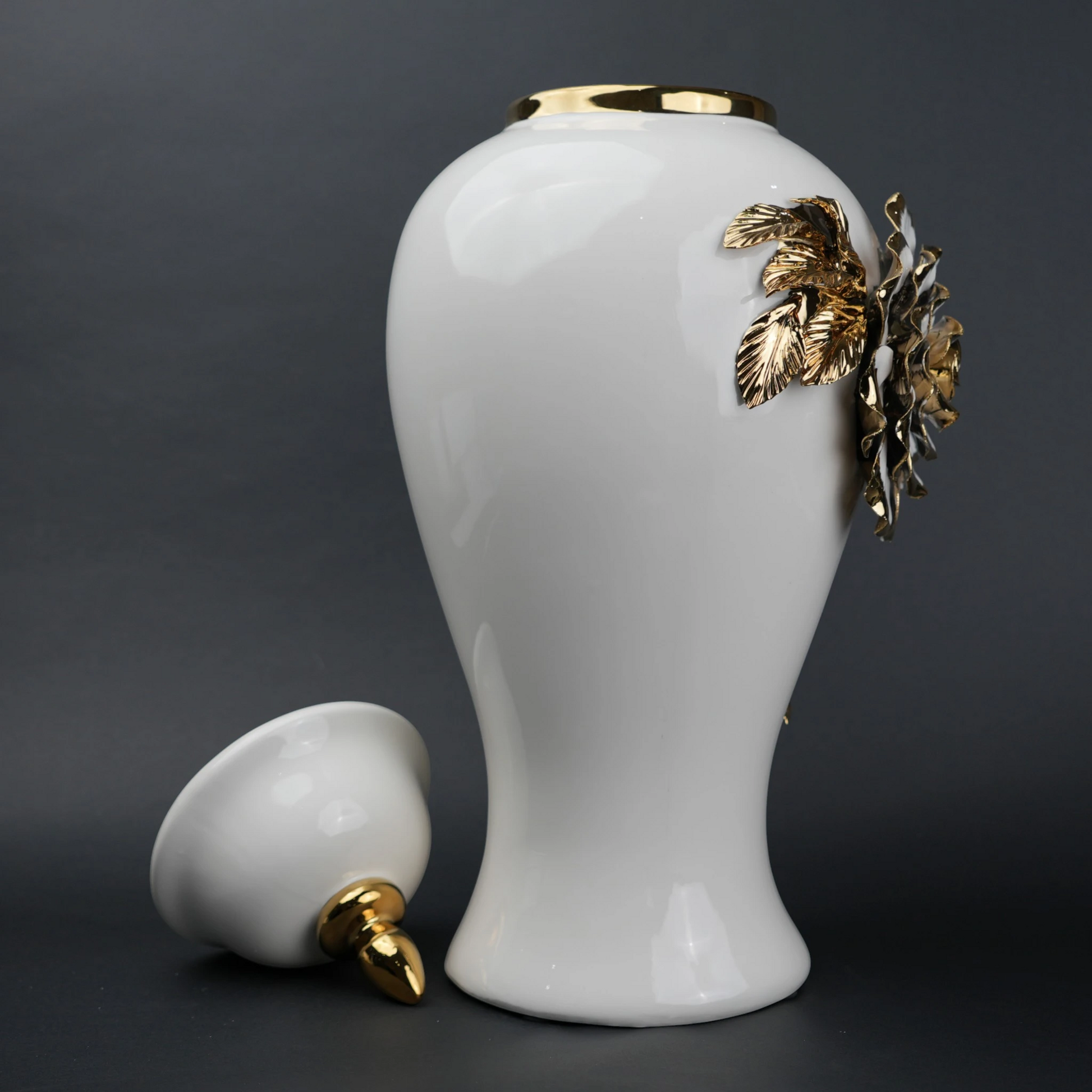 White ceramic jar with gold leaf design and lid
