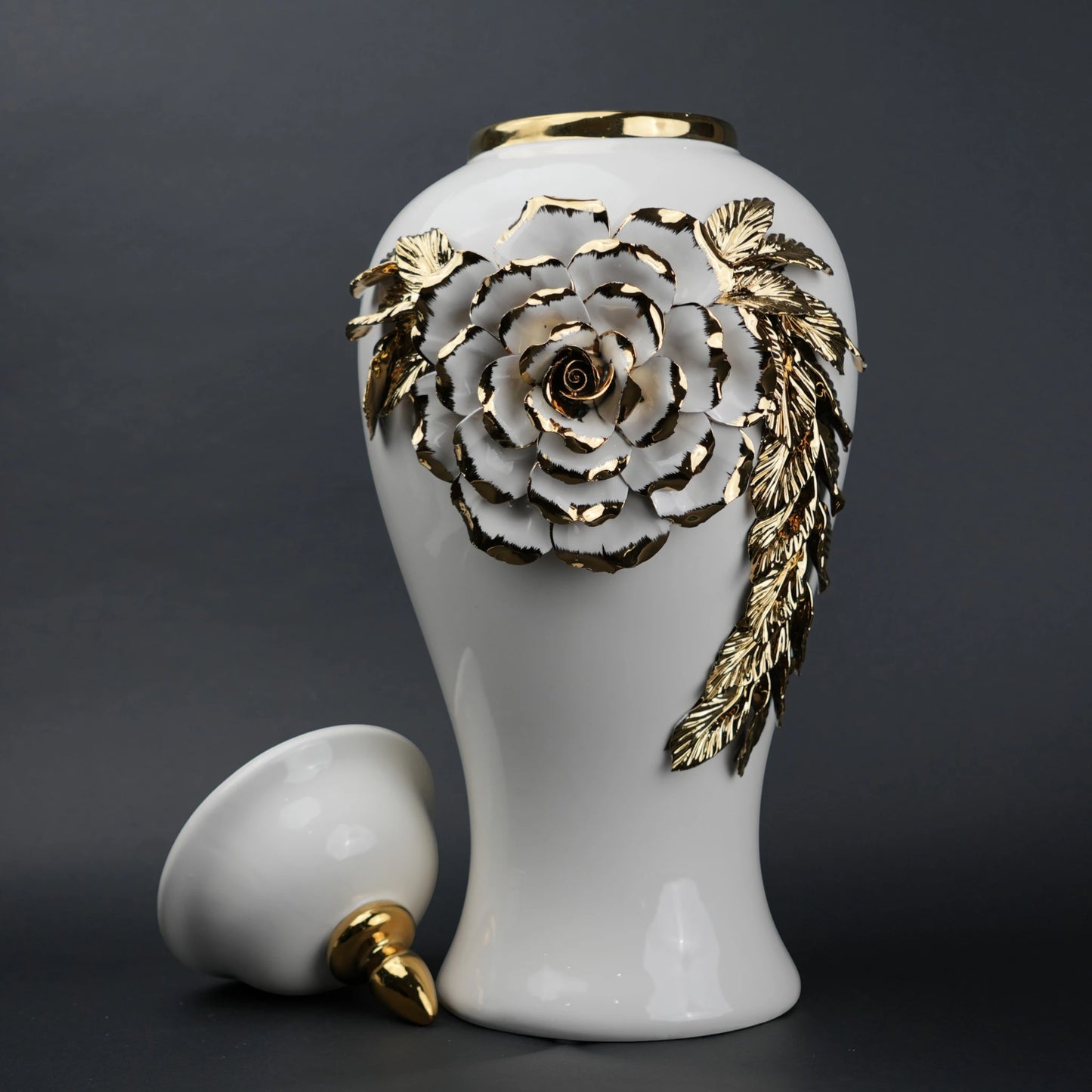 White ceramic jar with gold leaf design and lid