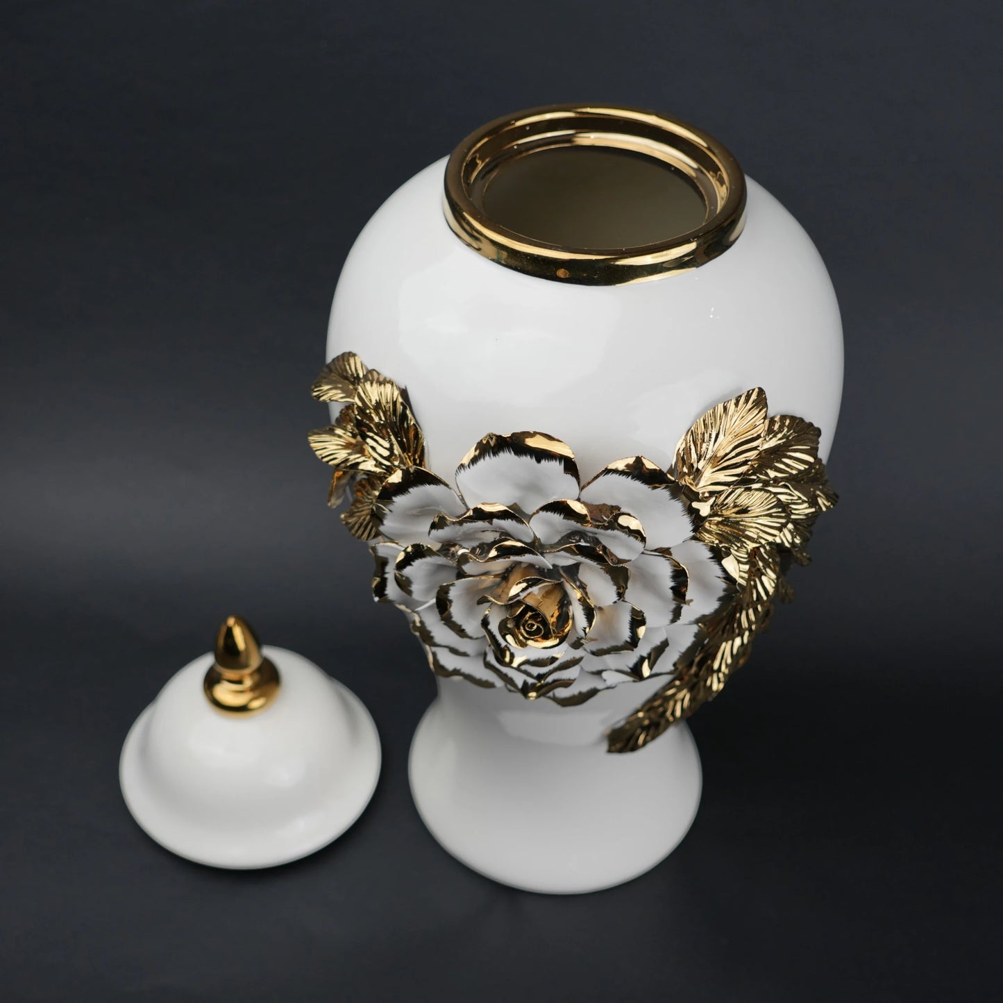 White ceramic jar with gold leaf design and lid
