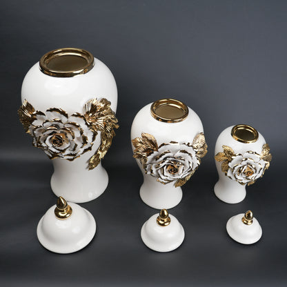 White ceramic jar with gold leaf design and lid