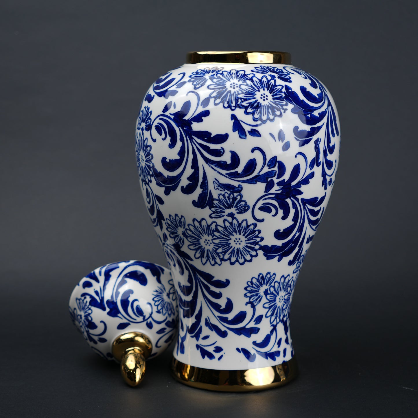 Blue and white ceramic jar with floral design and lid for home decor styling