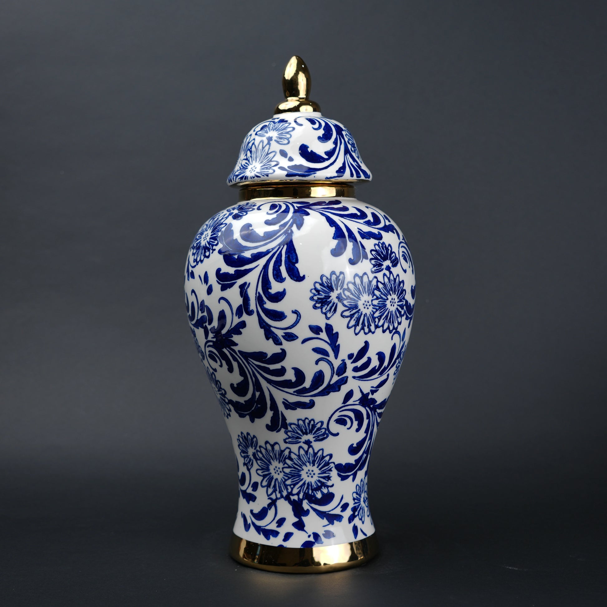 Blue and white ceramic jar with floral design and lid for home decor styling
