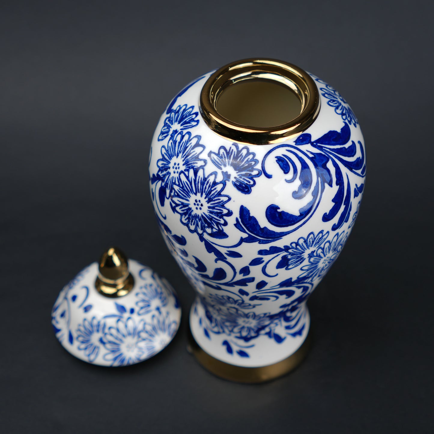 Blue and white ceramic jar with floral design and lid for home decor styling