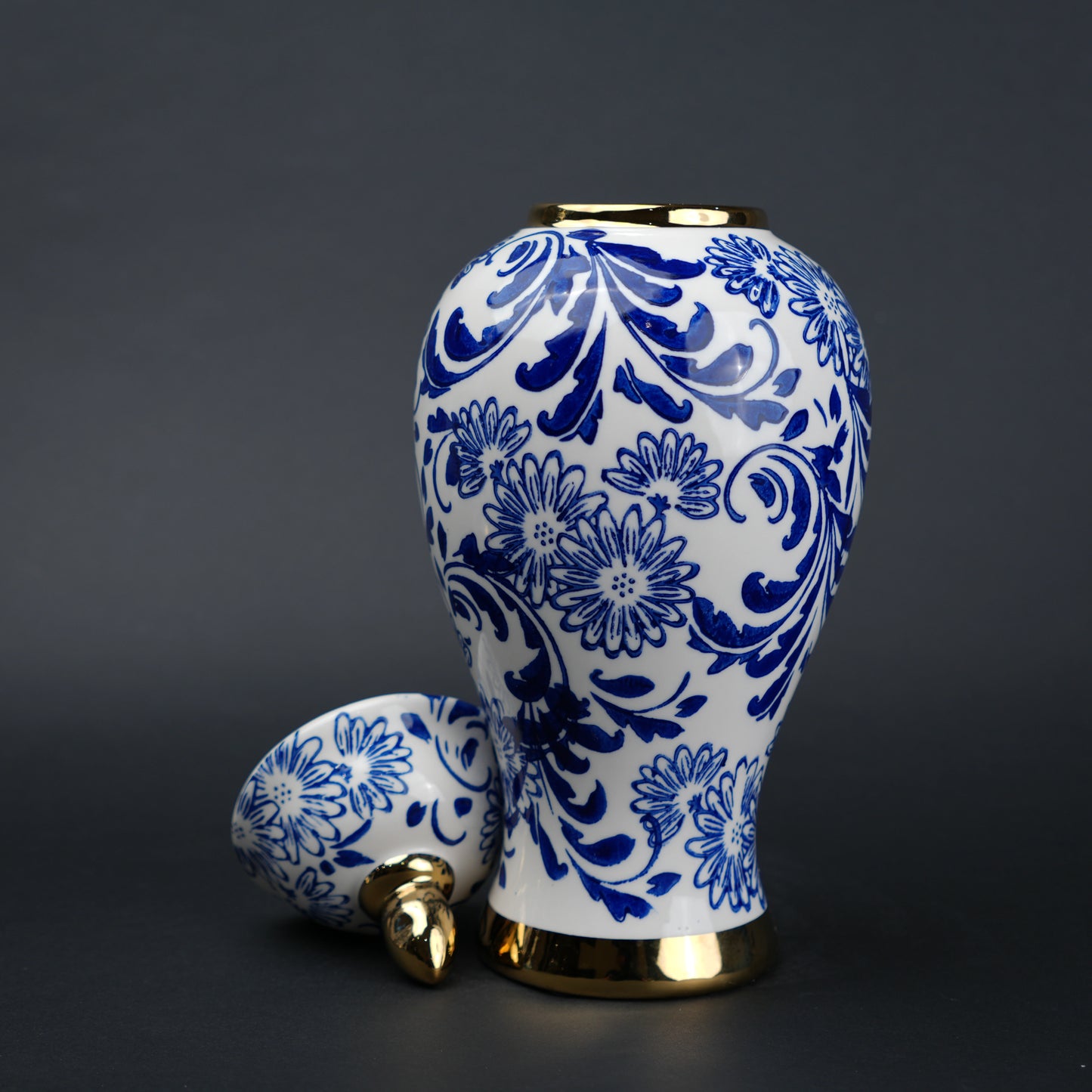 Blue and white ceramic jar with floral design and lid for home decor styling