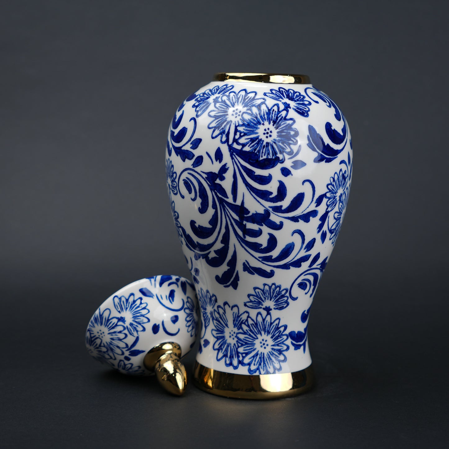 Blue and white ceramic jar with floral design and lid for home decor styling