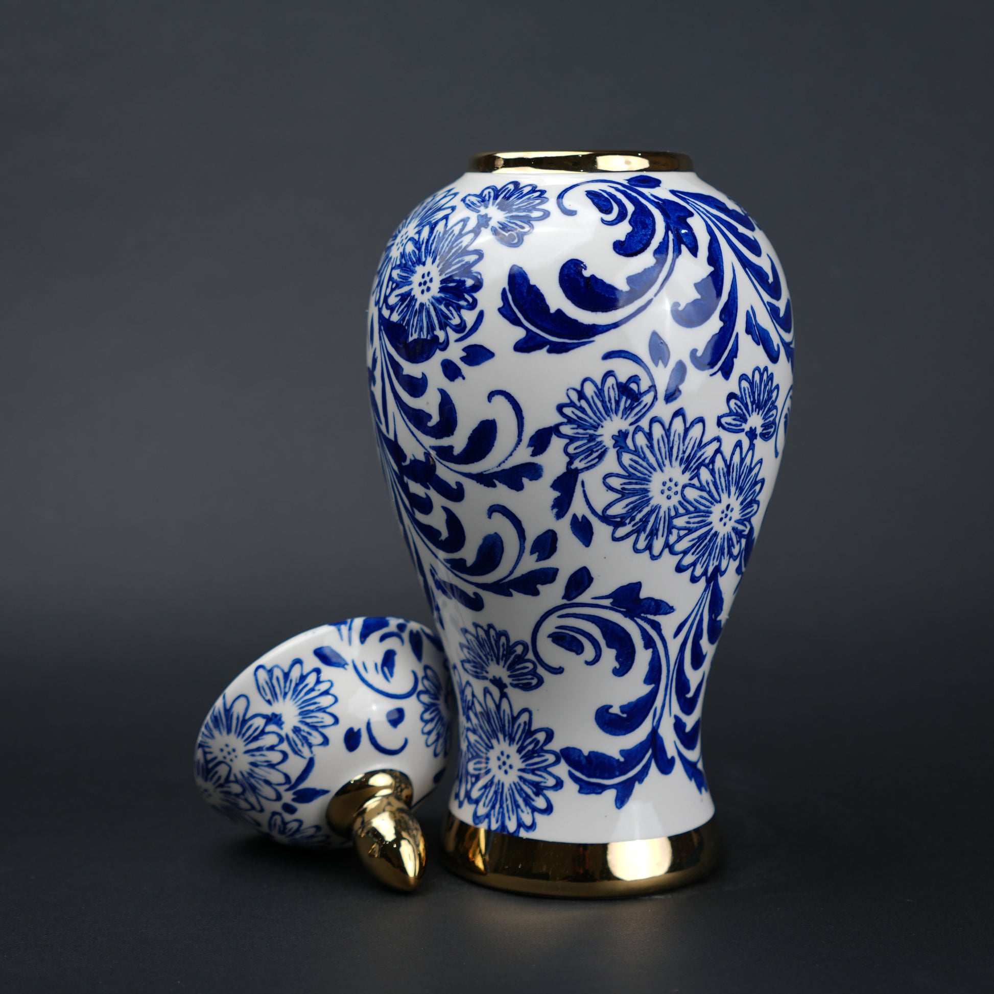 Blue and white ceramic jar with floral design and lid for home decor styling