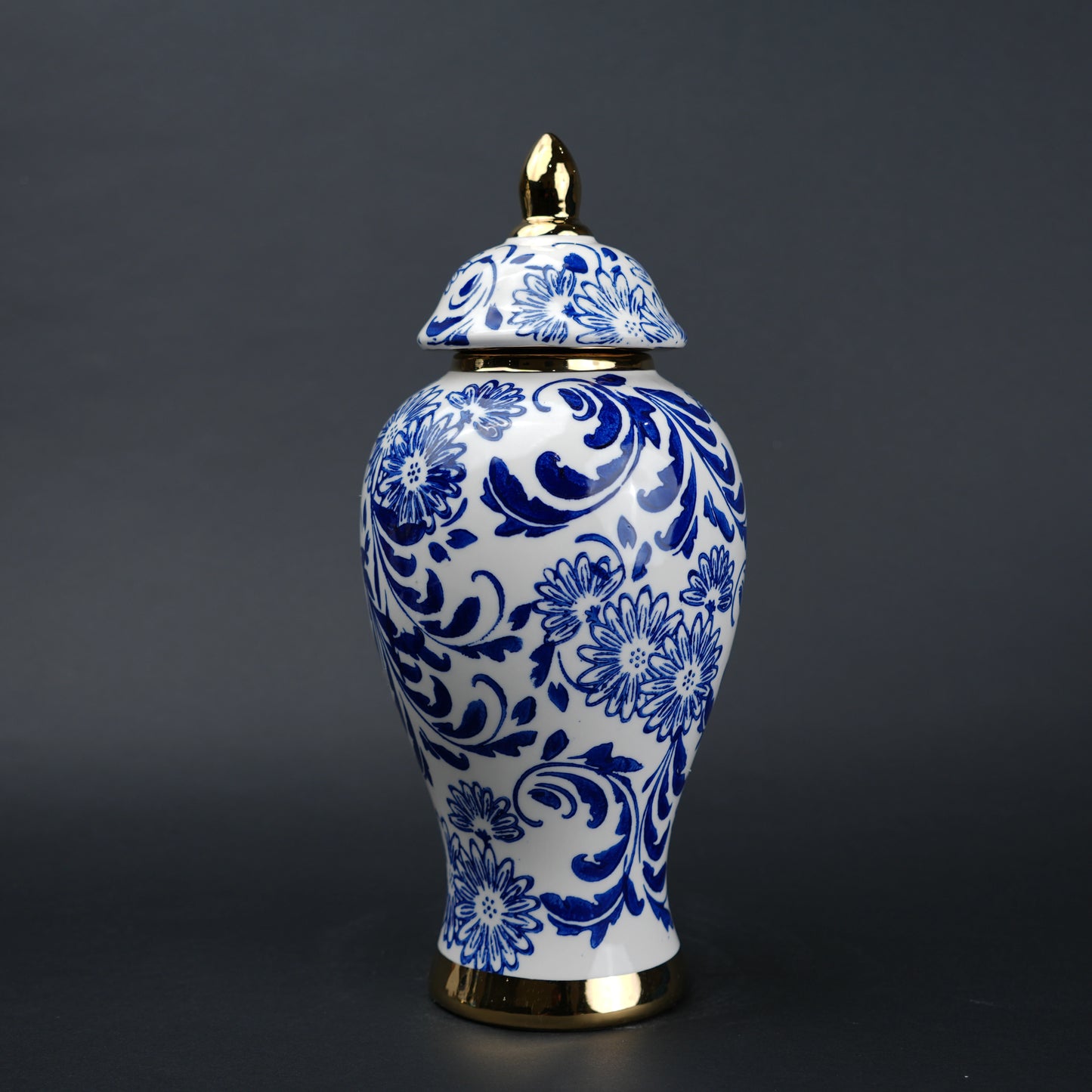 Blue and white ceramic jar with floral design and lid for home decor styling