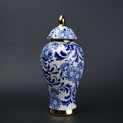 Blue and white ceramic jar with floral design and lid for home decor styling