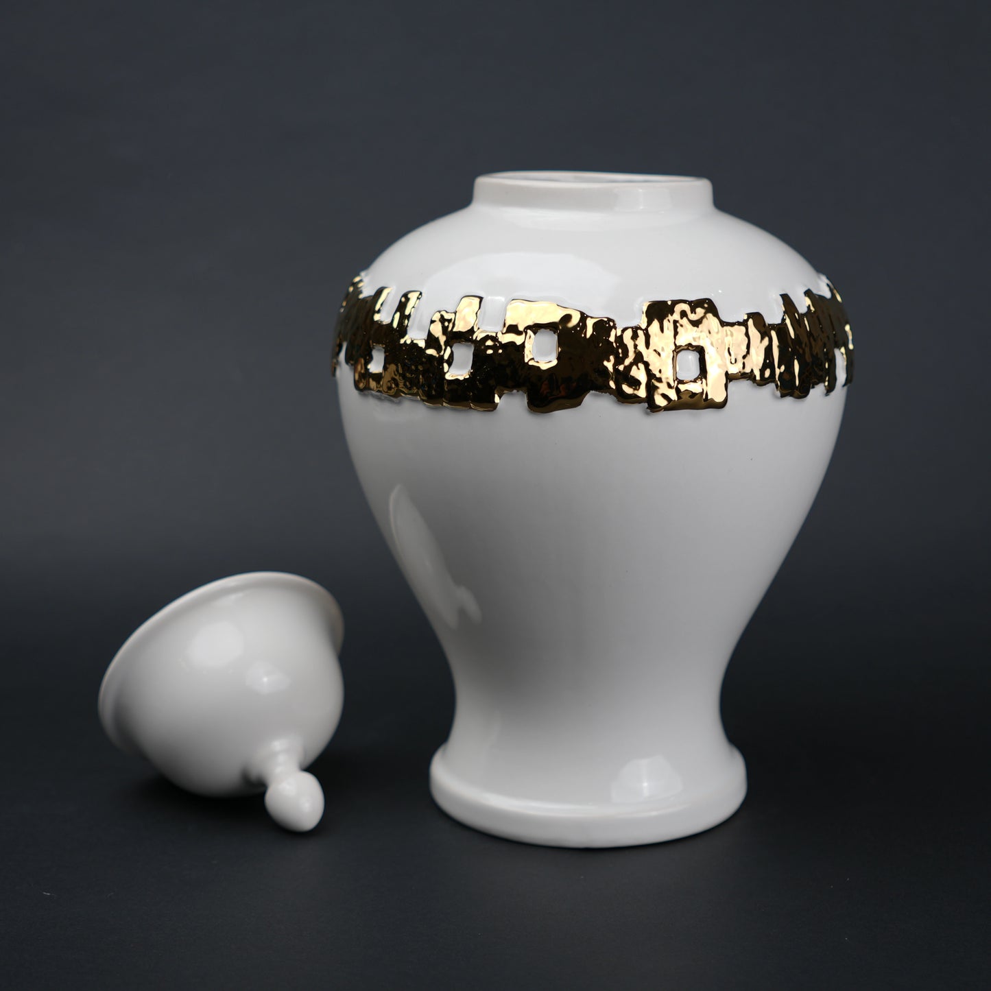 White ceramic jar with gold band detailing and lid for modern home decor styling