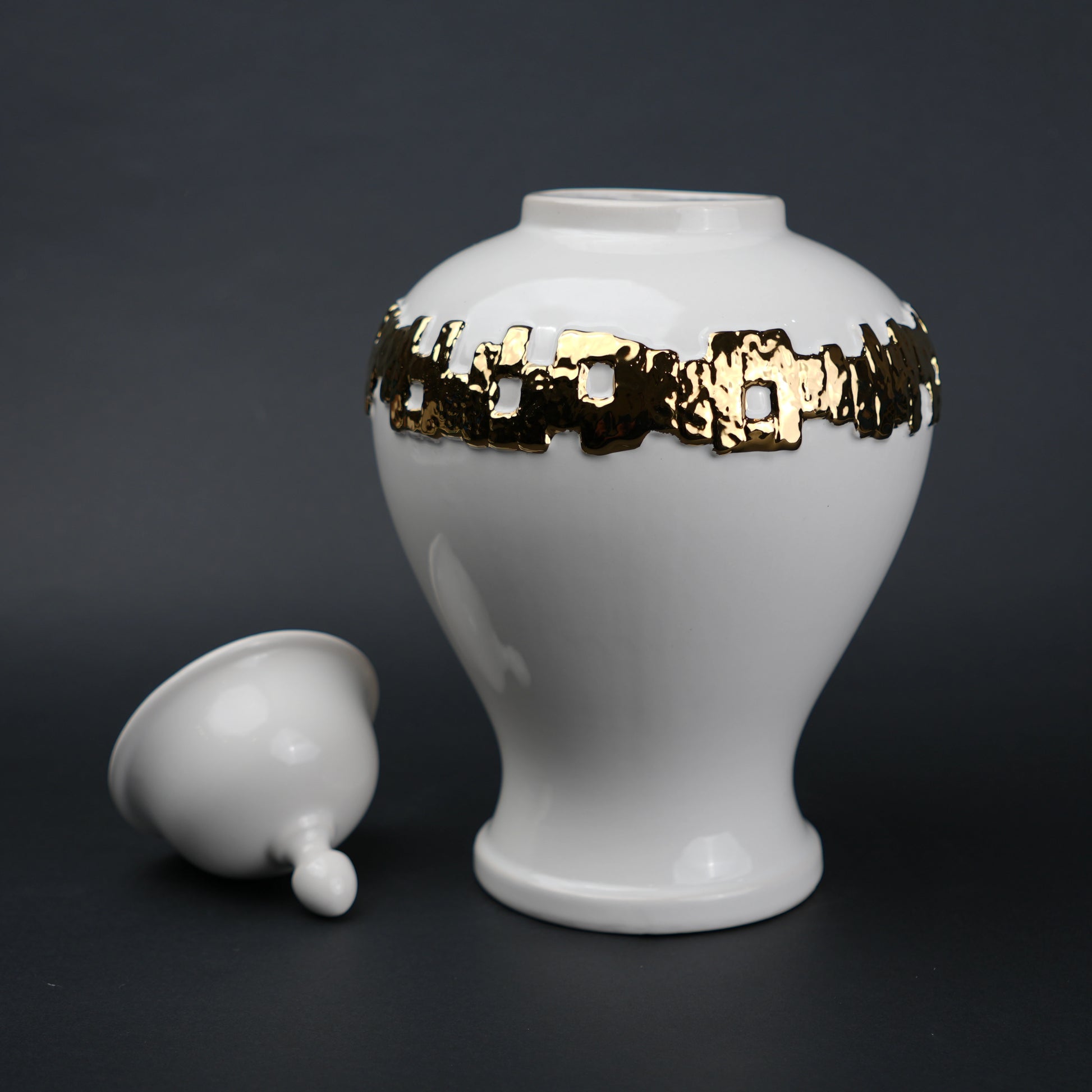White ceramic jar with gold band detailing and lid for modern home decor styling