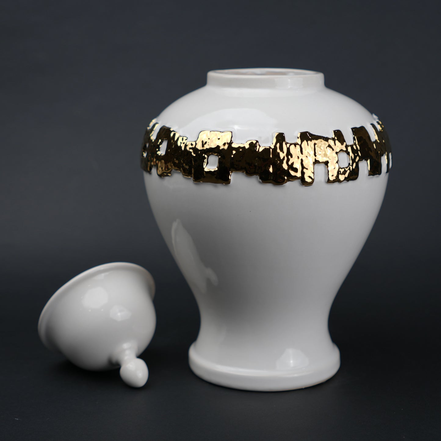 White ceramic jar with gold band detailing and lid for modern home decor styling