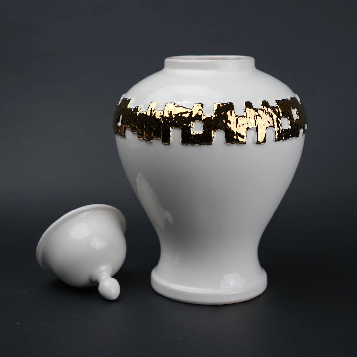White ceramic jar with gold band detailing and lid for modern home decor styling