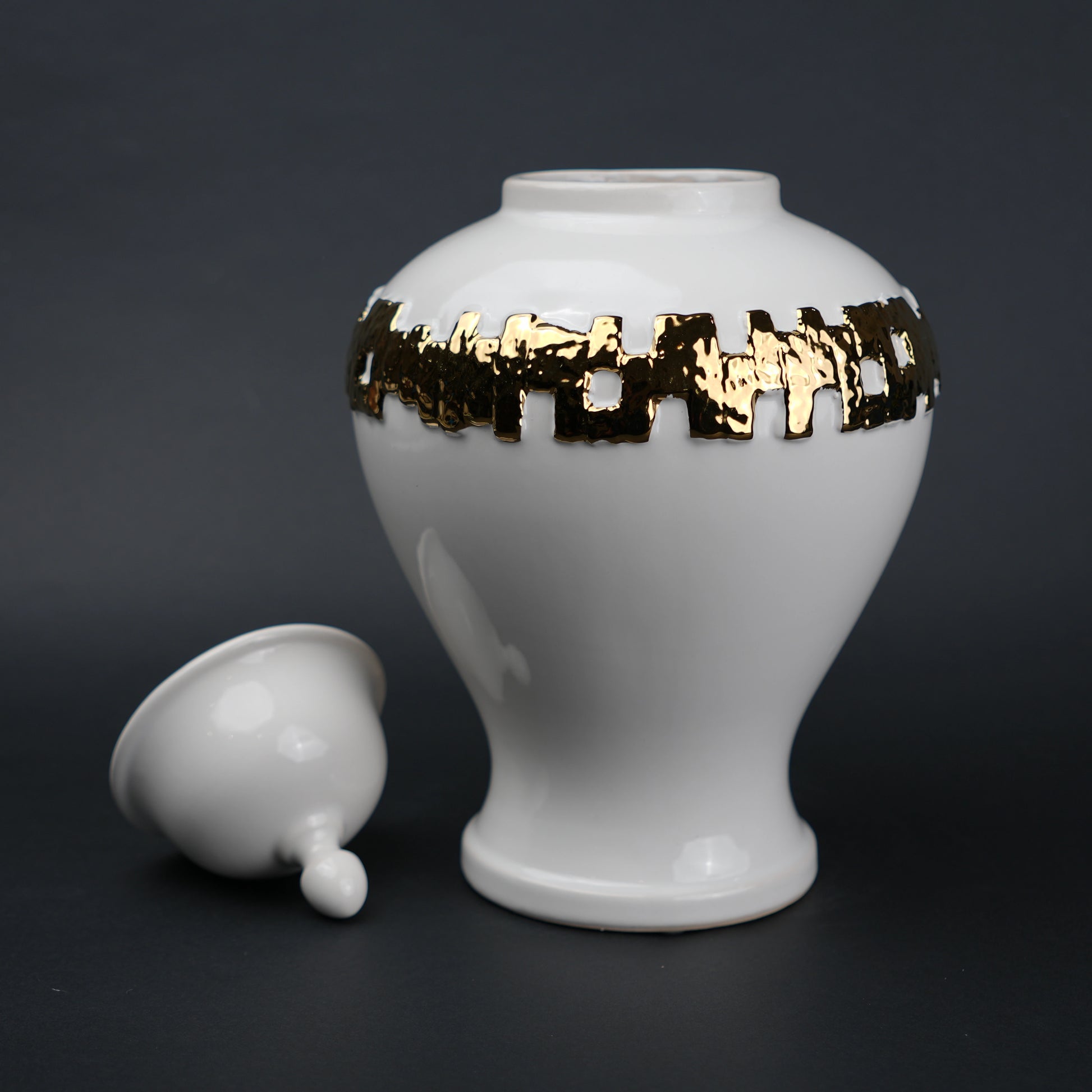 White ceramic jar with gold band detailing and lid for modern home decor styling