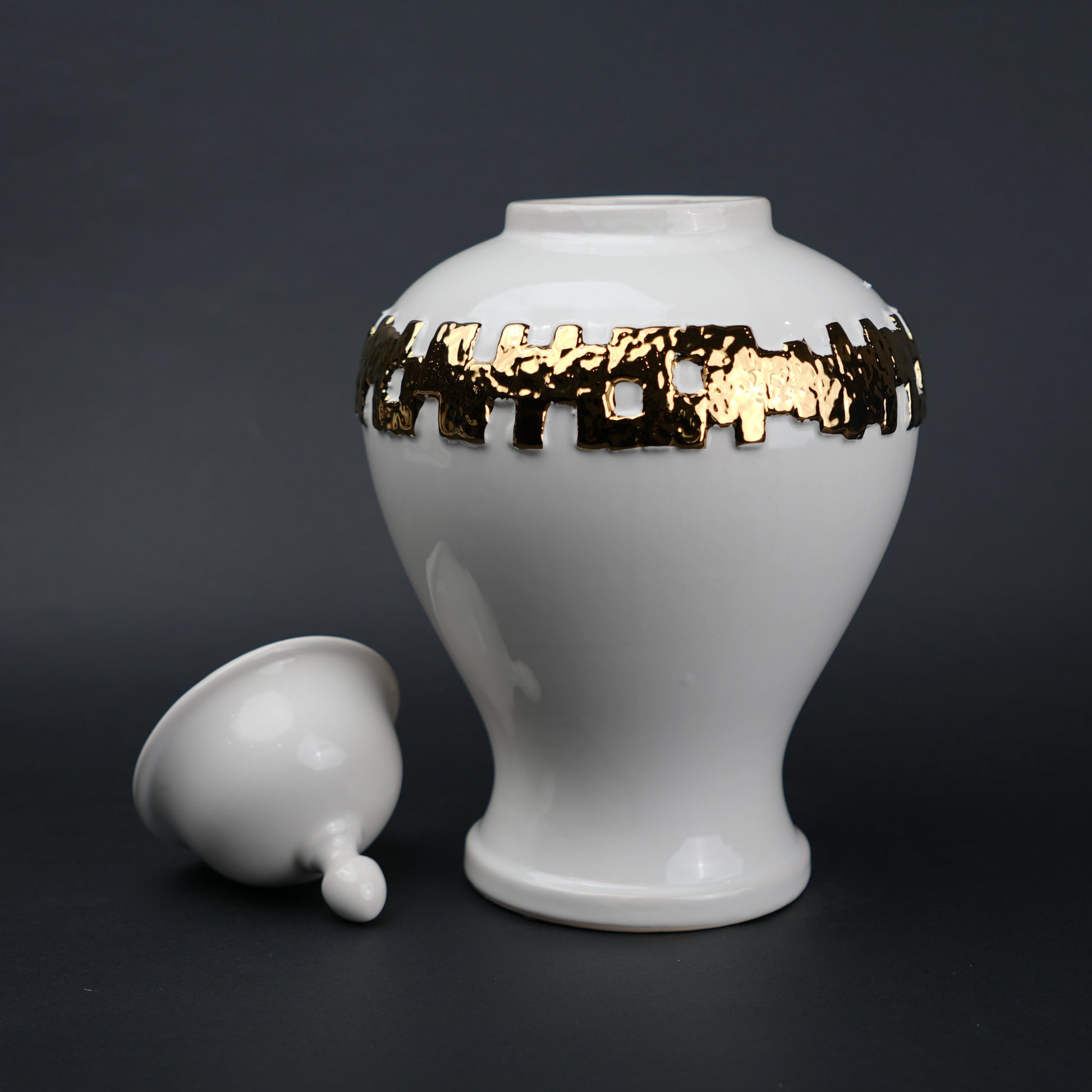 White ceramic jar with gold band detailing and lid for modern home decor styling