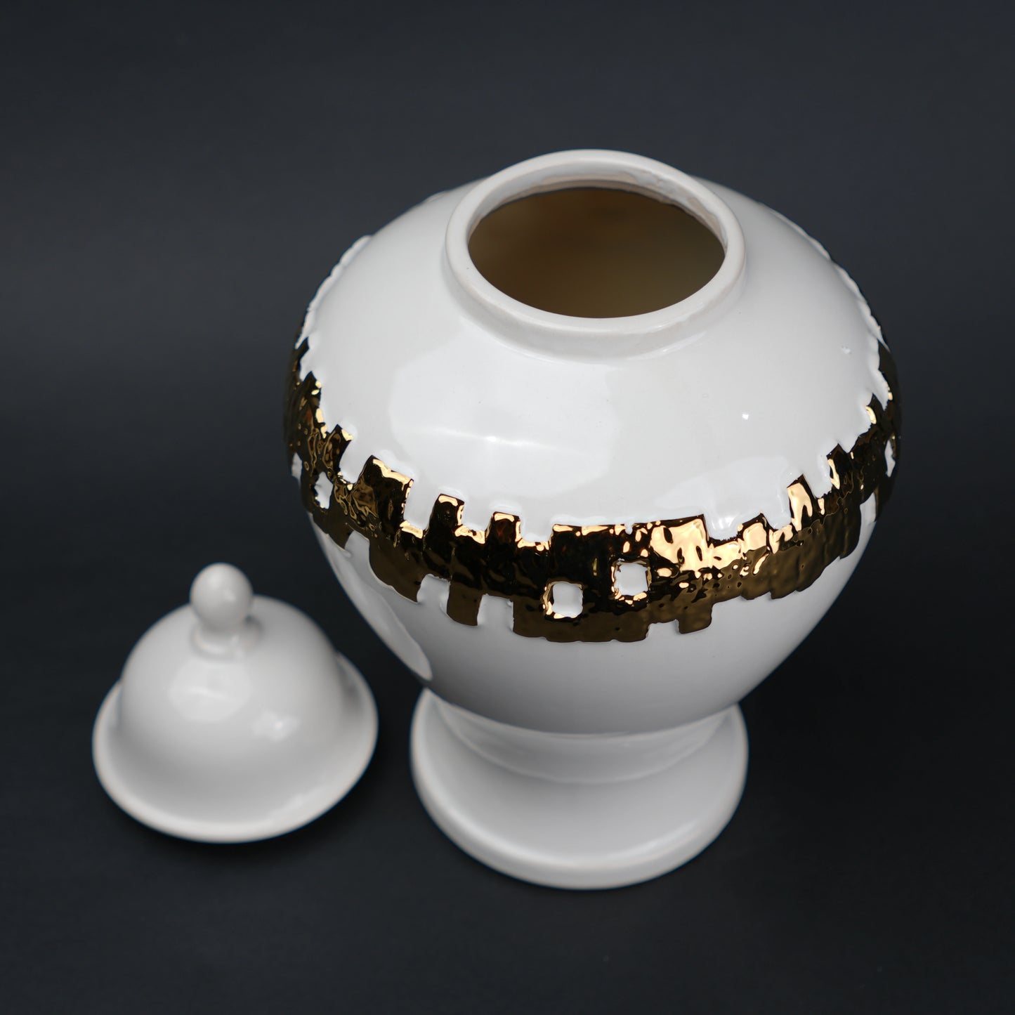White ceramic jar with gold band detailing and lid for modern home decor styling