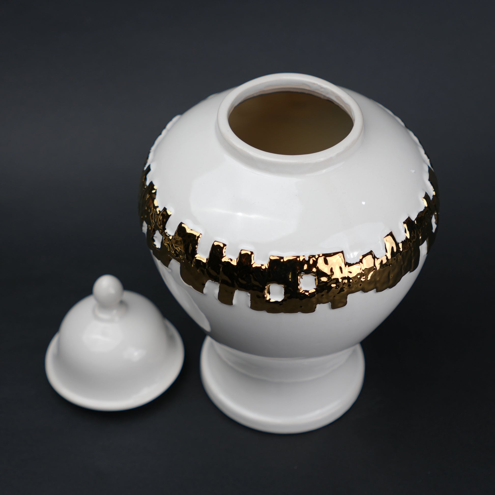 White ceramic jar with gold band detailing and lid for modern home decor styling