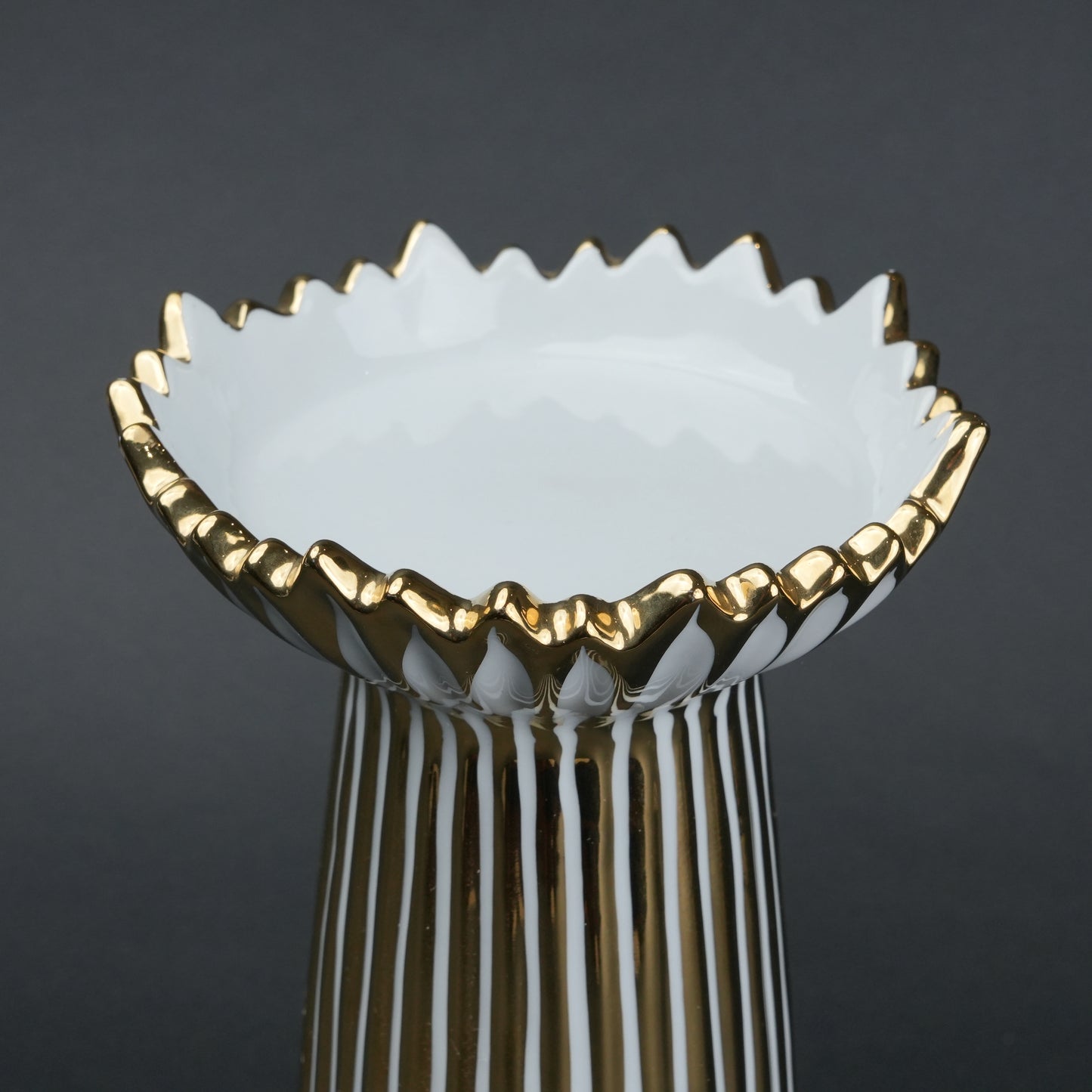White ceramic candle holder with gold scalloped rim and fluted base for modern home decor styling