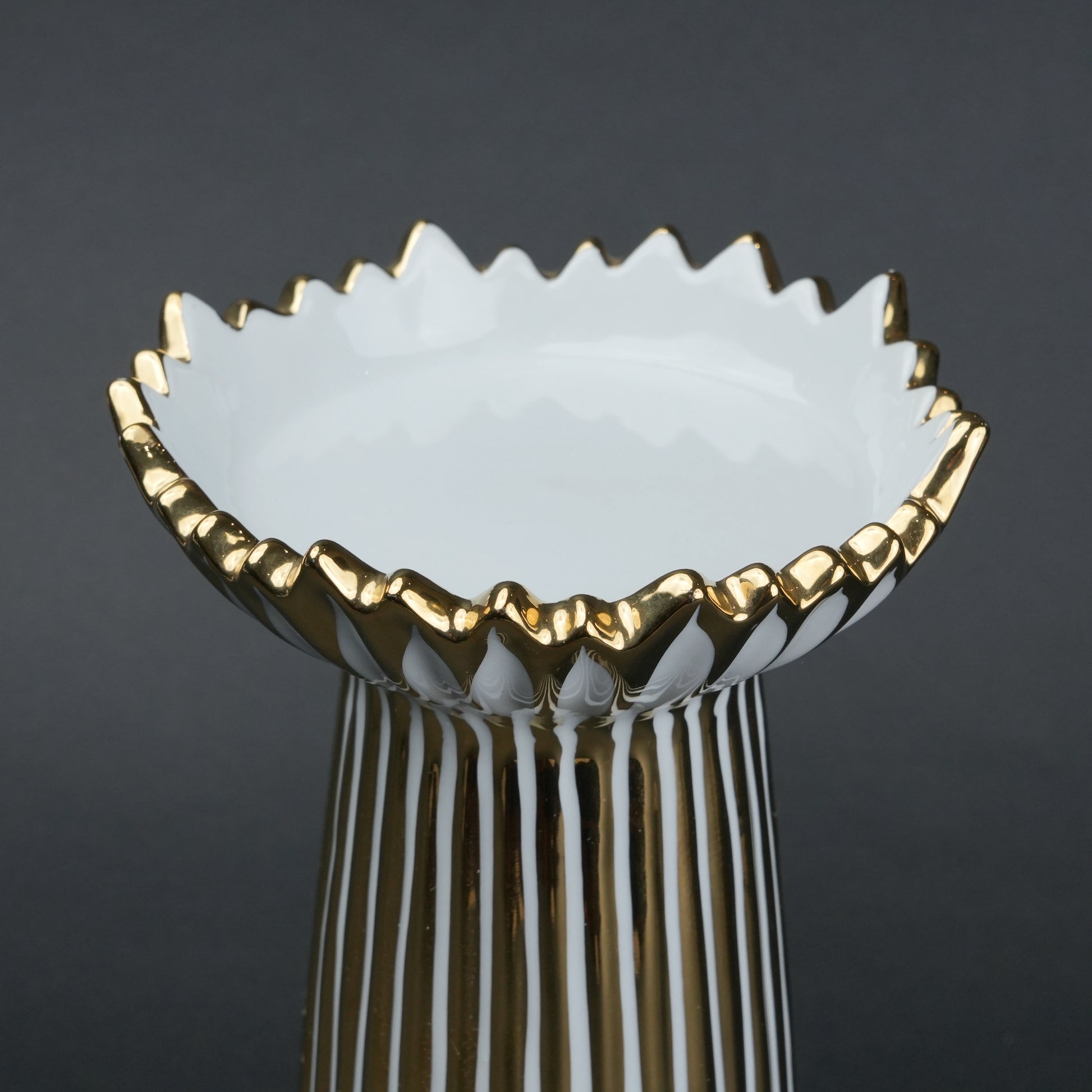 White ceramic candle holder with gold scalloped rim and fluted base for modern home decor styling