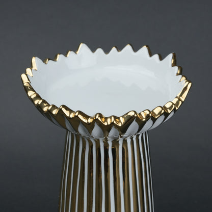 White ceramic candle holder with gold scalloped rim and fluted base for modern home decor styling