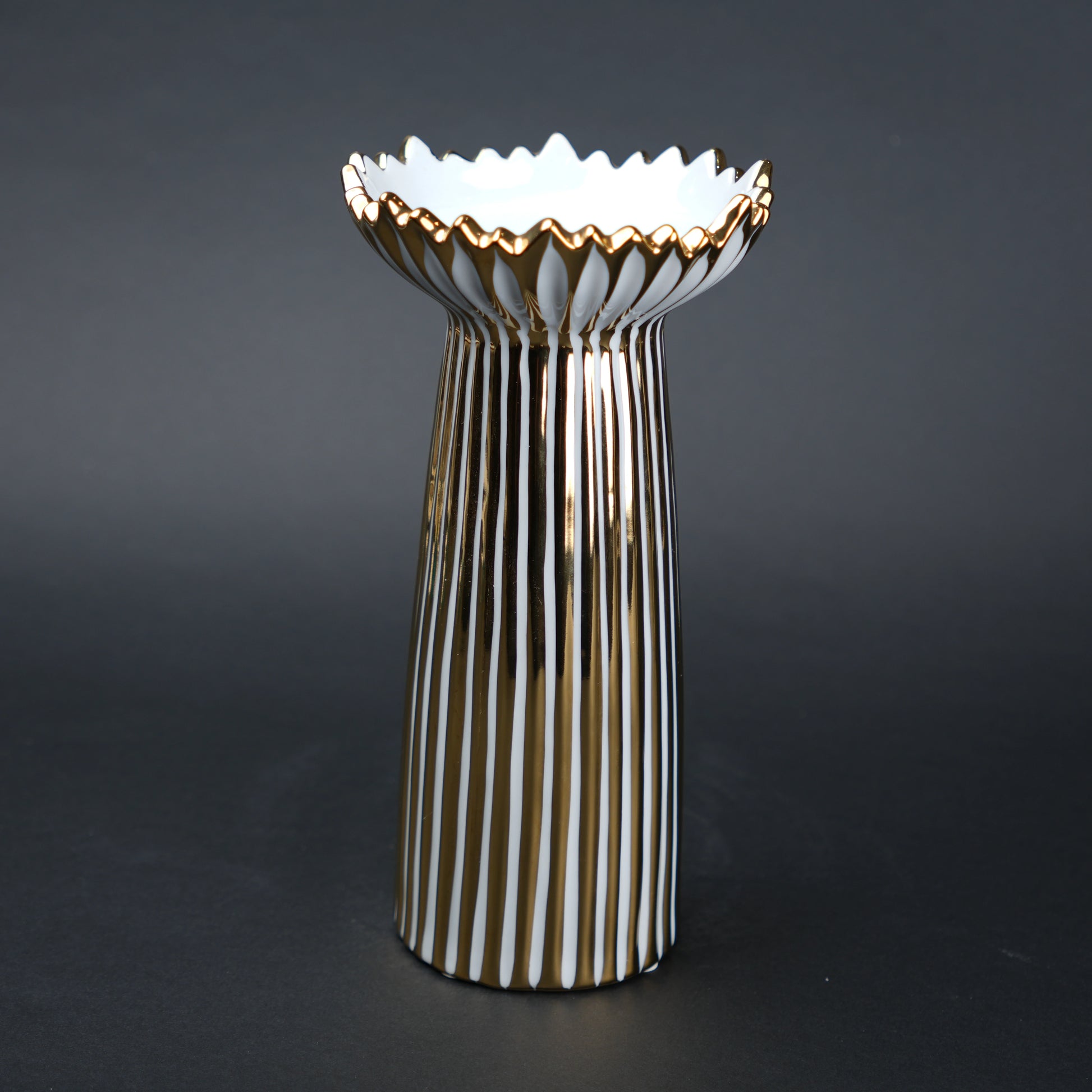 White ceramic candle holder with gold scalloped rim and fluted base for modern home decor styling