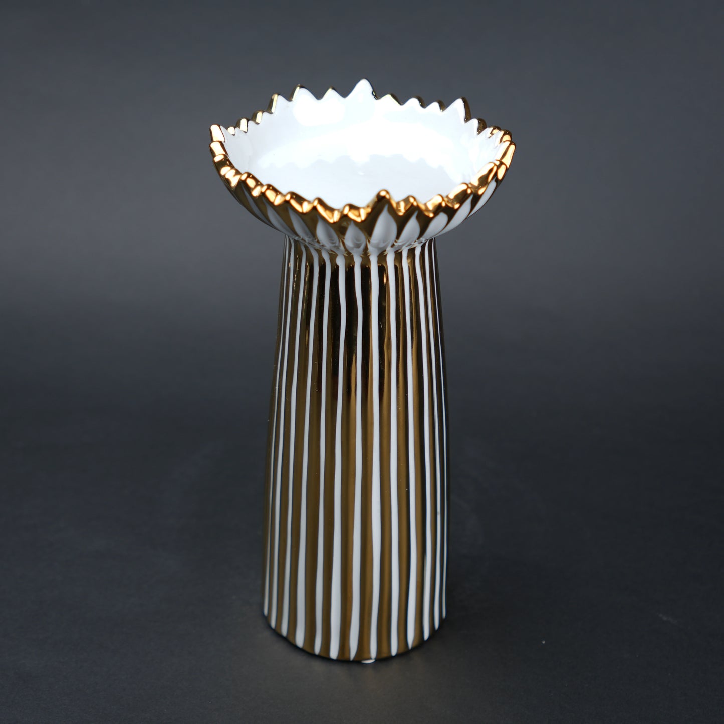 White ceramic candle holder with gold scalloped rim and fluted base for modern home decor styling