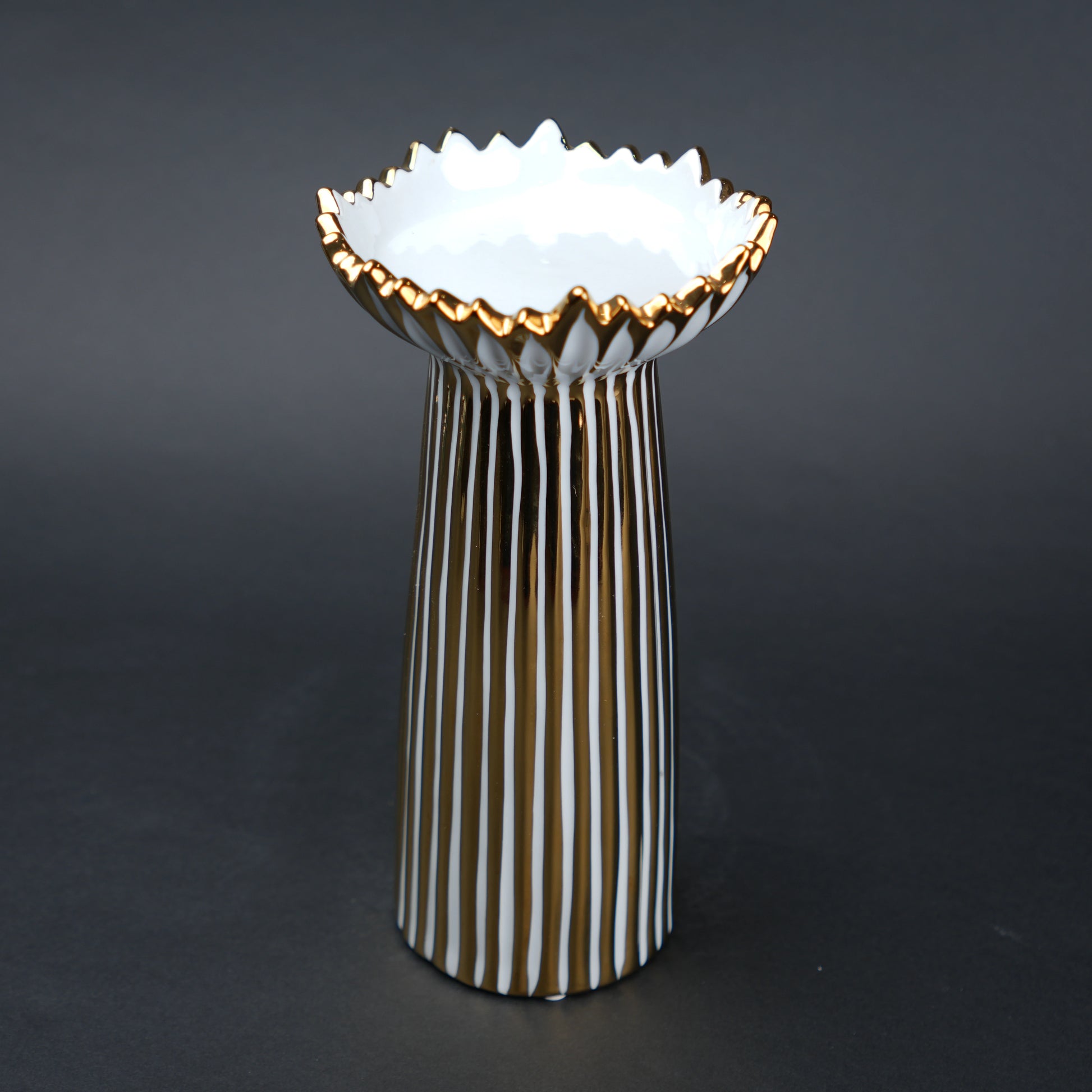White ceramic candle holder with gold scalloped rim and fluted base for modern home decor styling