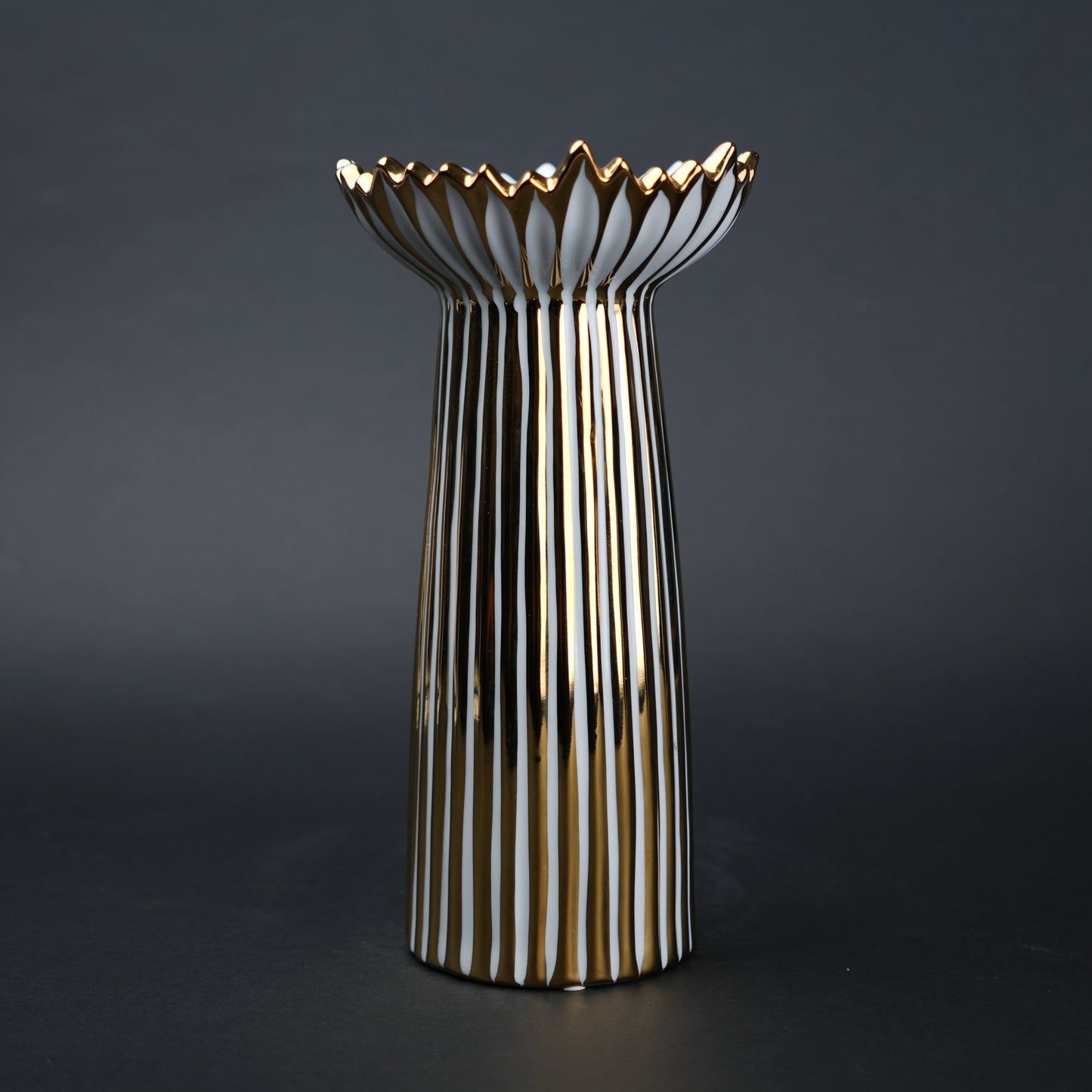White ceramic candle holder with gold scalloped rim and fluted base for modern home decor styling