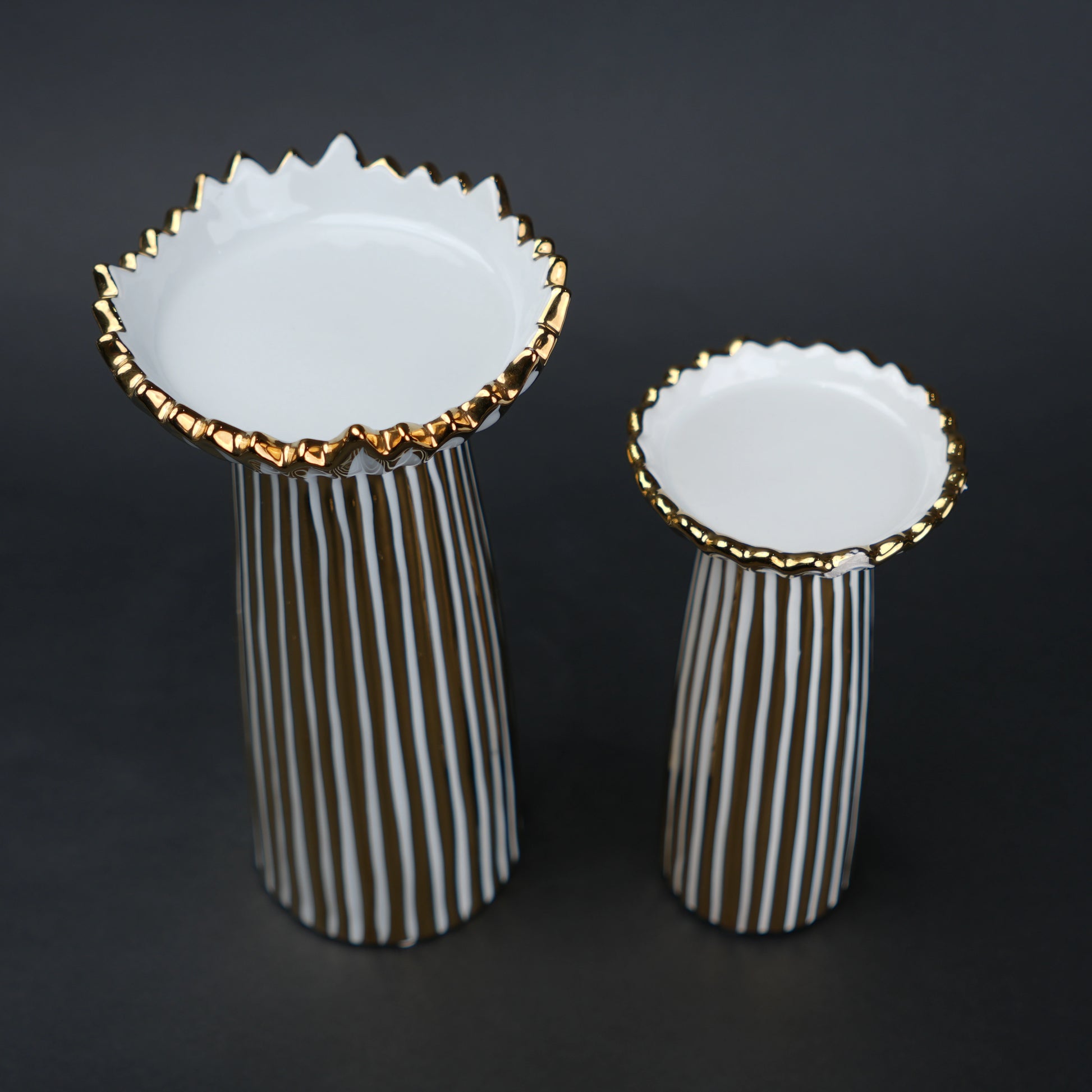 White ceramic candle holder with gold scalloped rim and fluted base for modern home decor styling
