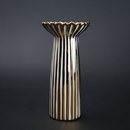 White ceramic candle holder with gold scalloped rim and fluted base for modern home decor styling