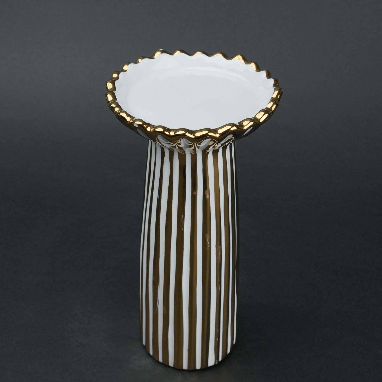 White ceramic candle holder with gold scalloped rim and fluted base for modern home decor styling