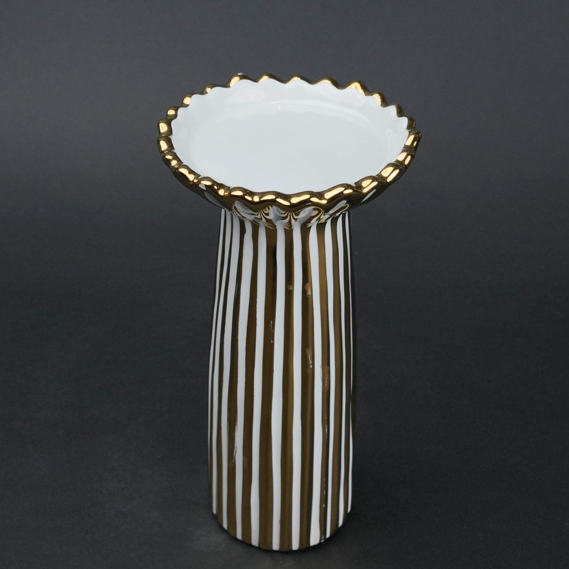 White ceramic candle holder with gold scalloped rim and fluted base for modern home decor styling