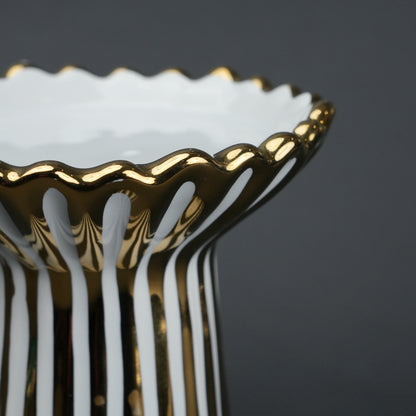 White ceramic candle holder with gold scalloped rim and fluted base for modern home decor styling