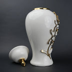 White ceramic jar with gold petal detailing and lid for decor and flower vase styling