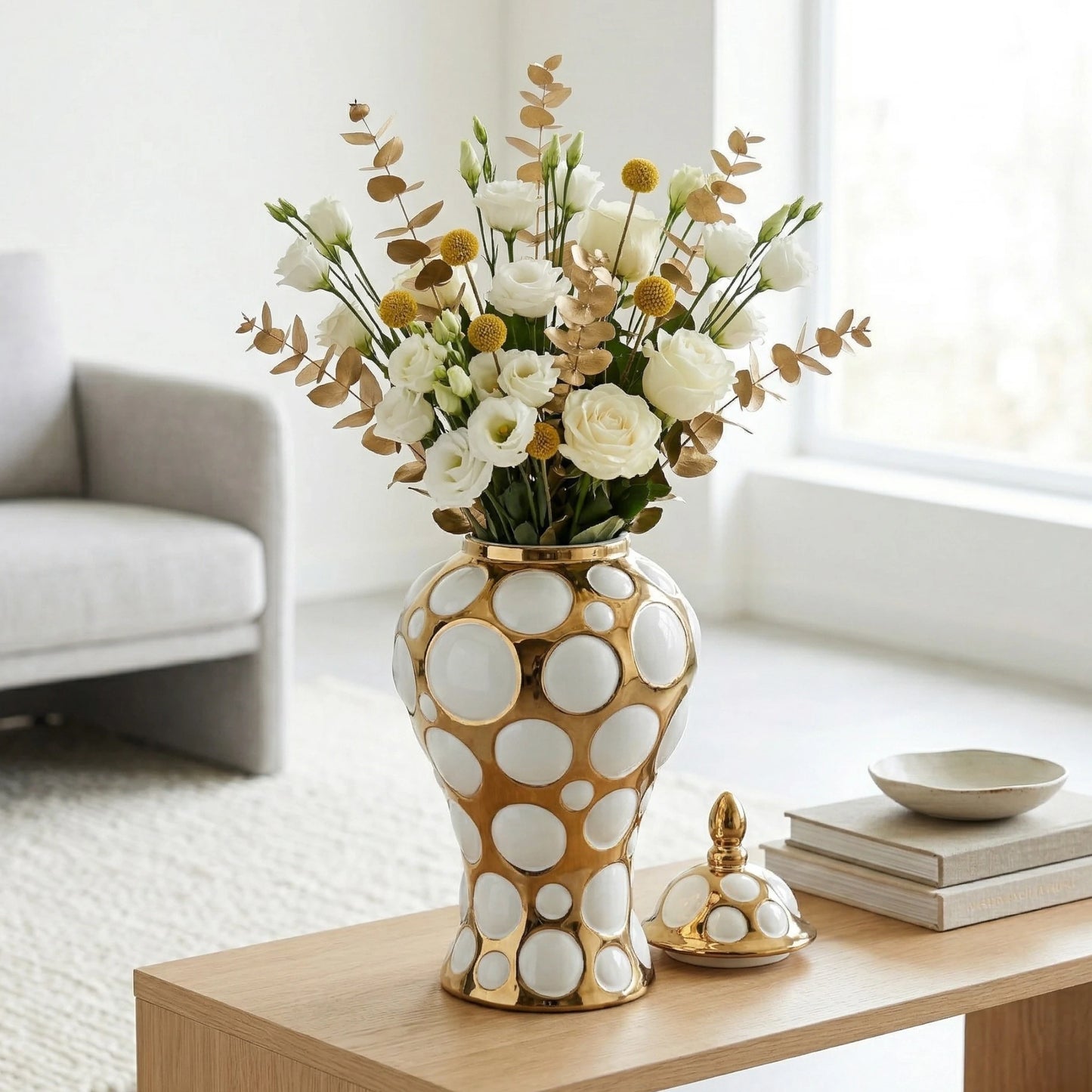 Gilded orbit jar w/ roses on coffee table