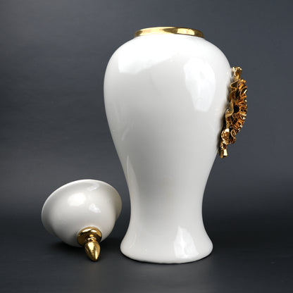 White ceramic decorative jar with gold sculpted floral design and lid