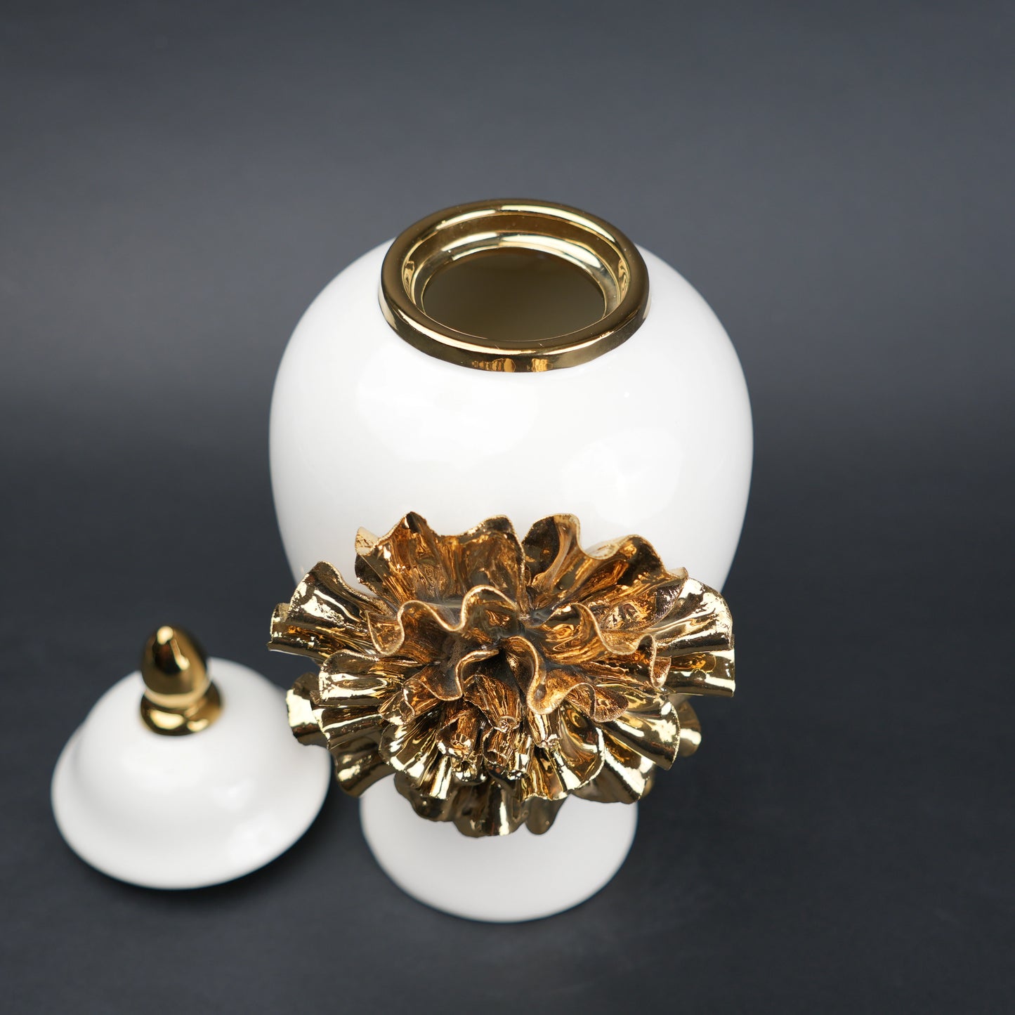 White ceramic decorative jar with gold laurel leaf band and lid