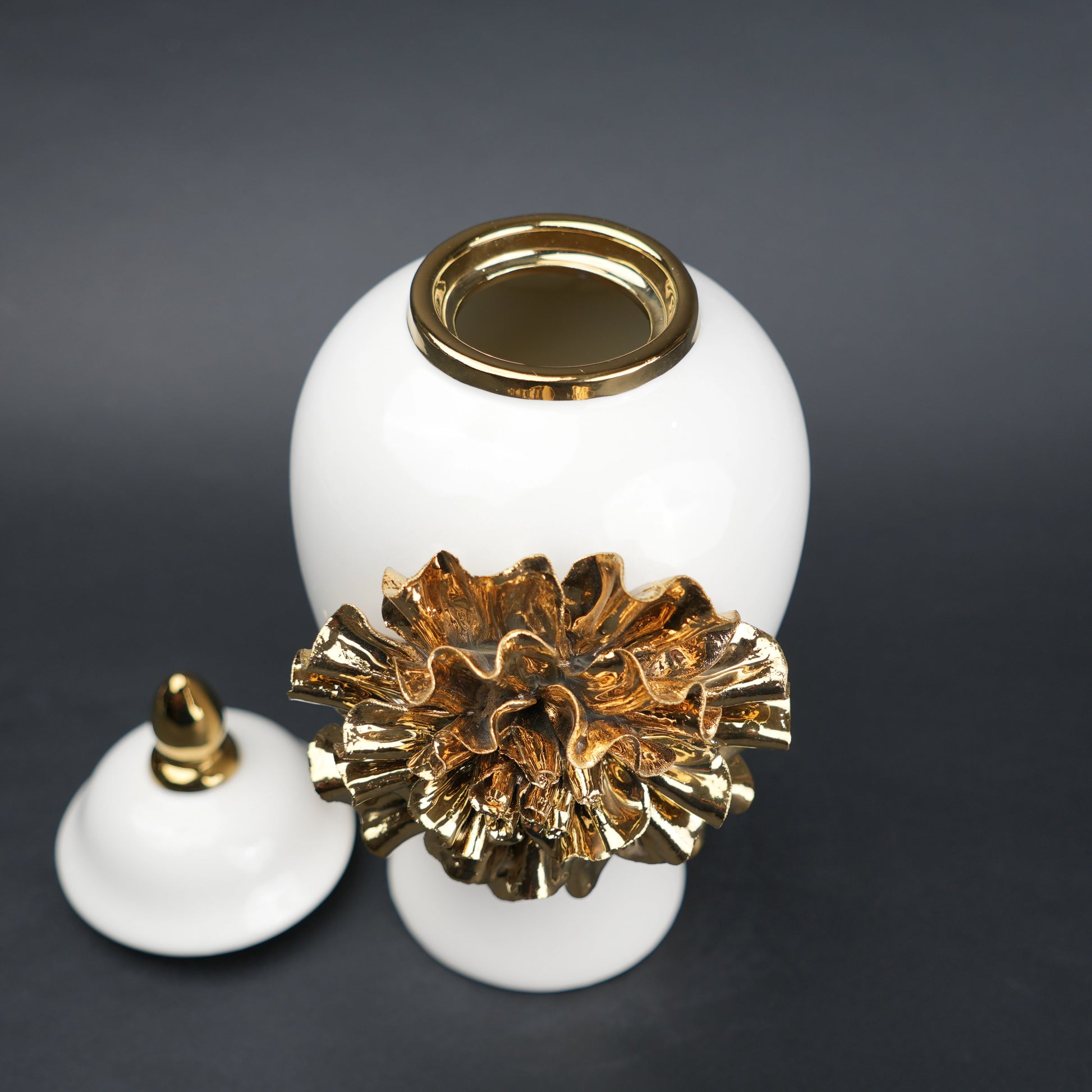 White ceramic decorative jar with gold laurel leaf band and lid