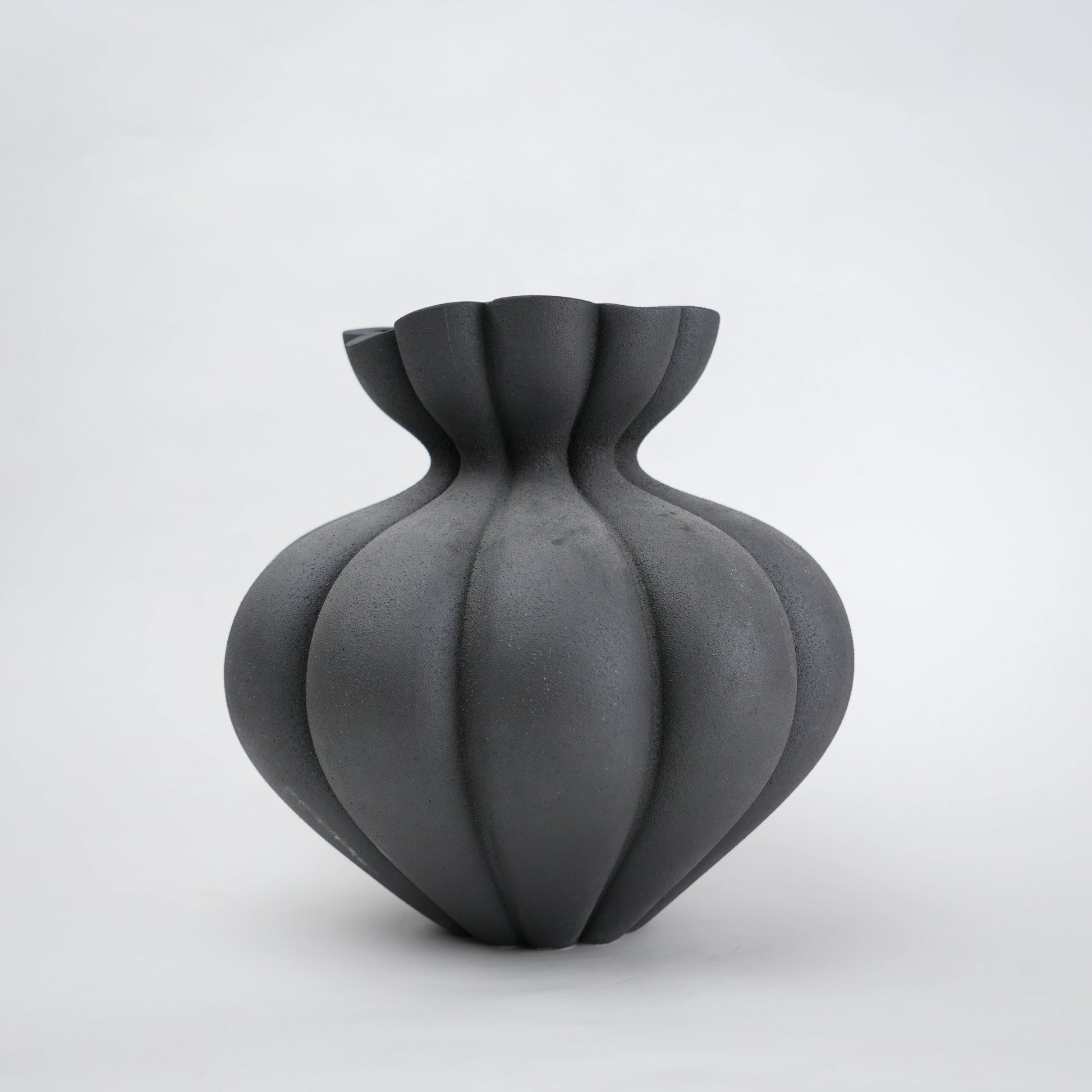 Fluted ceramic vase in matte charcoal for modern home decor styling