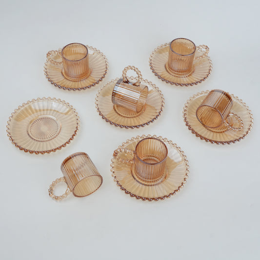 beaded glass tea cup and saucer set available in amber and clear textured glass for modern table setting