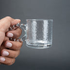 beaded glass tea cup and saucer set available in amber and clear textured glass for modern table setting