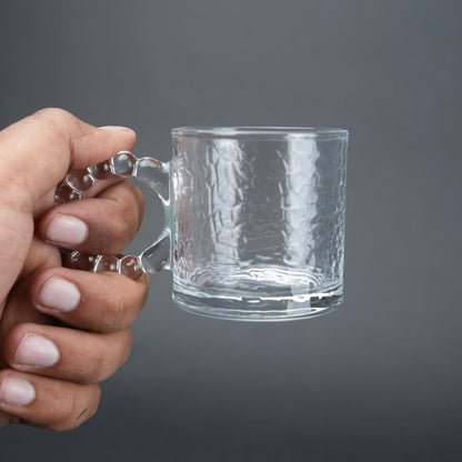 beaded glass tea cup and saucer set available in amber and clear textured glass for modern table setting