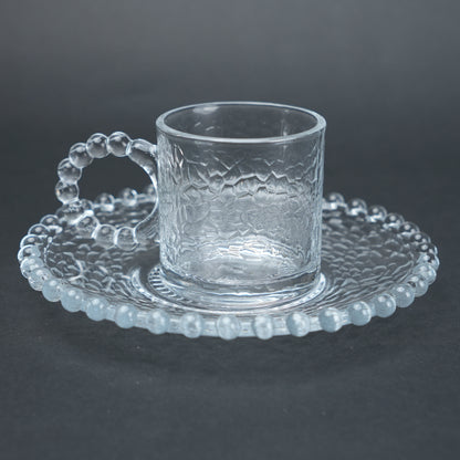 beaded glass tea cup and saucer set available in amber and clear textured glass for modern table setting