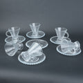 clear textured glass flared tea cup and saucer set with beaded handle for modern table setting