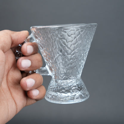 clear textured glass flared tea cup and saucer set with beaded handle for modern table setting
